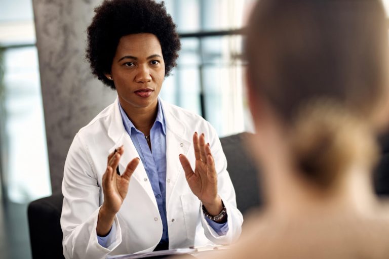 african-american-therapist-counseling-her-patient-during-session